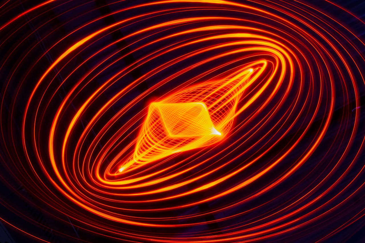 Vibrant abstract spiral with dynamic light trails creating an energetic visual effect.